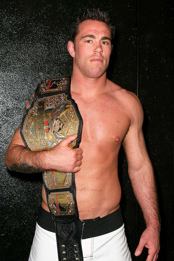 Jake Shields Celebrates Victory With Championship Belt Wallpaper