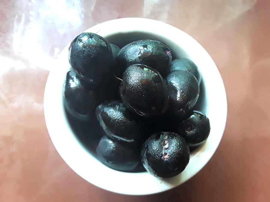 Java Plums Glossy Wooden Table Wallpaper