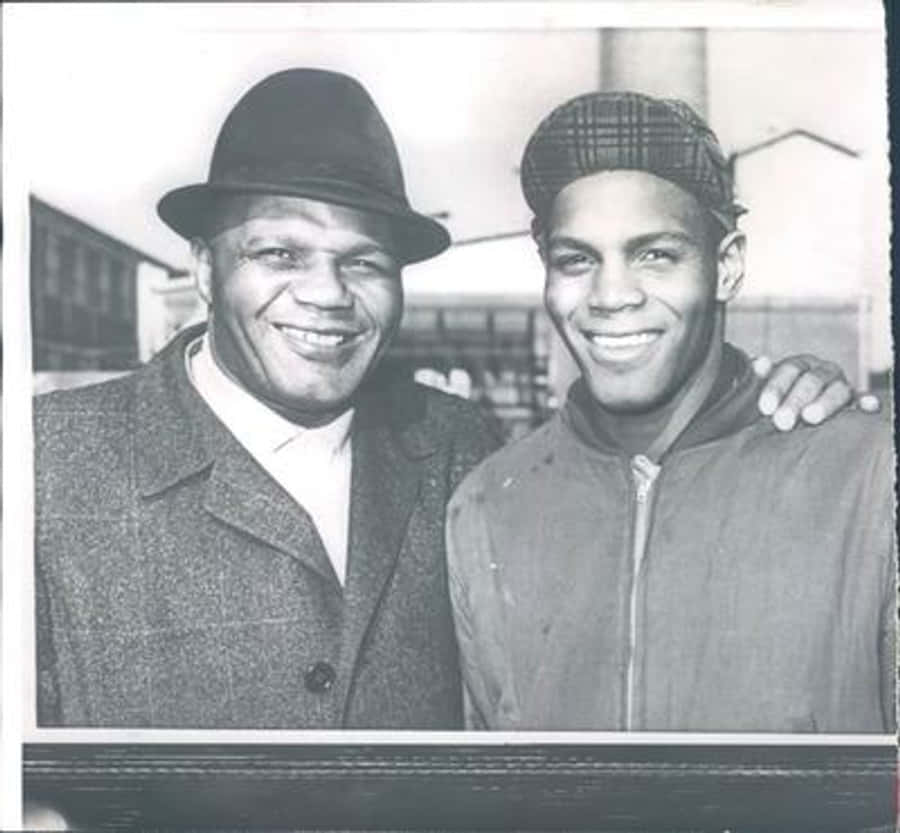 Jersey Joe Walcott And His Grandson Wallpaper