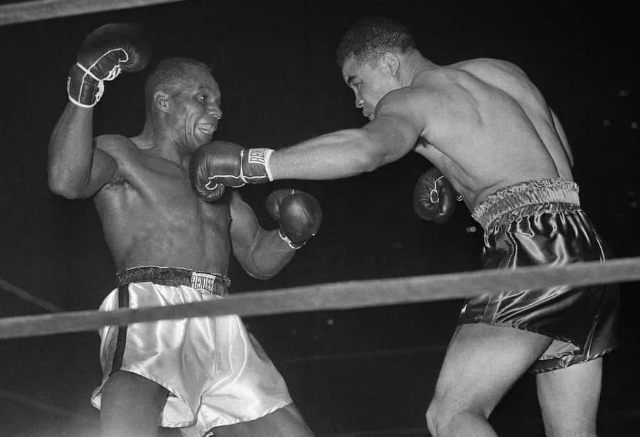 Jersey Joe Walcott Vs Joe Louis Boxing Match Wallpaper