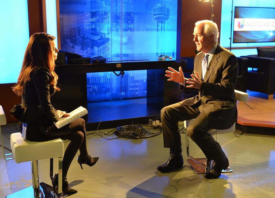 John Cornyn Being Interviewed By A Woman Wallpaper