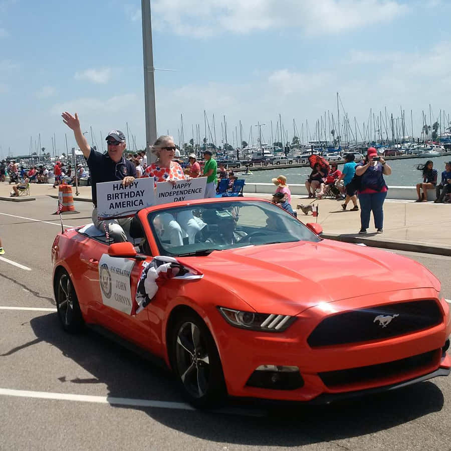 John Cornyn Riding On A Car Wallpaper