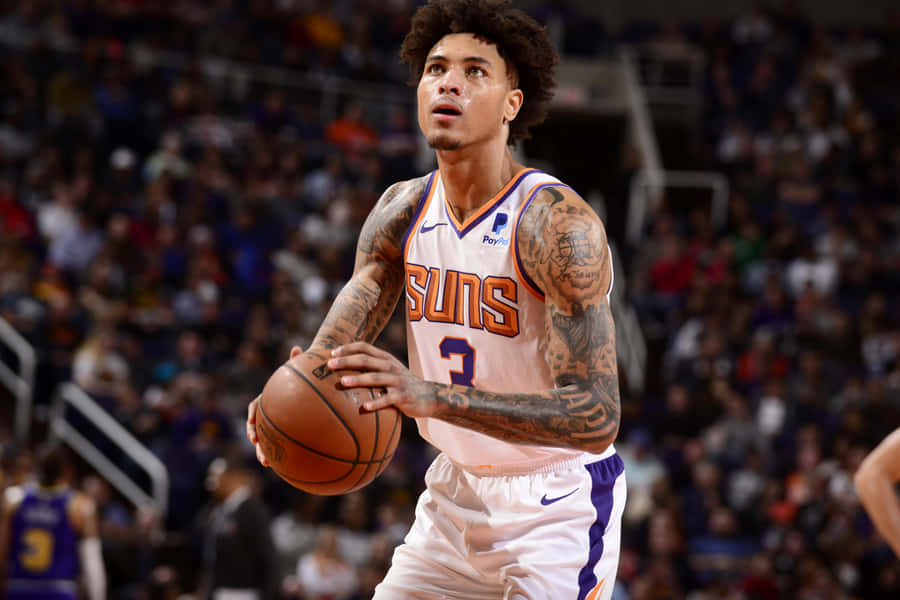 Kelly Oubre Jr Showing Off His Skills On The Court Wallpaper