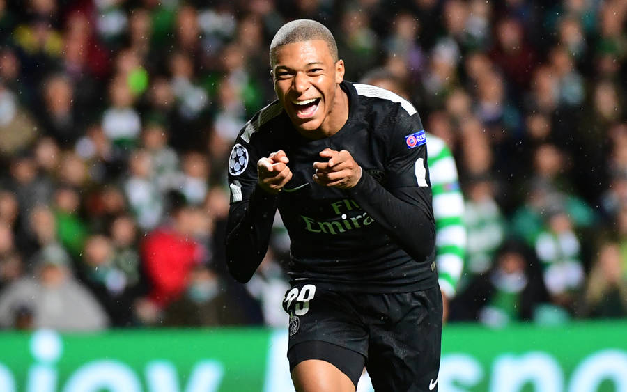 Kylian Mbappe Happy Pointing At Camera Wallpaper