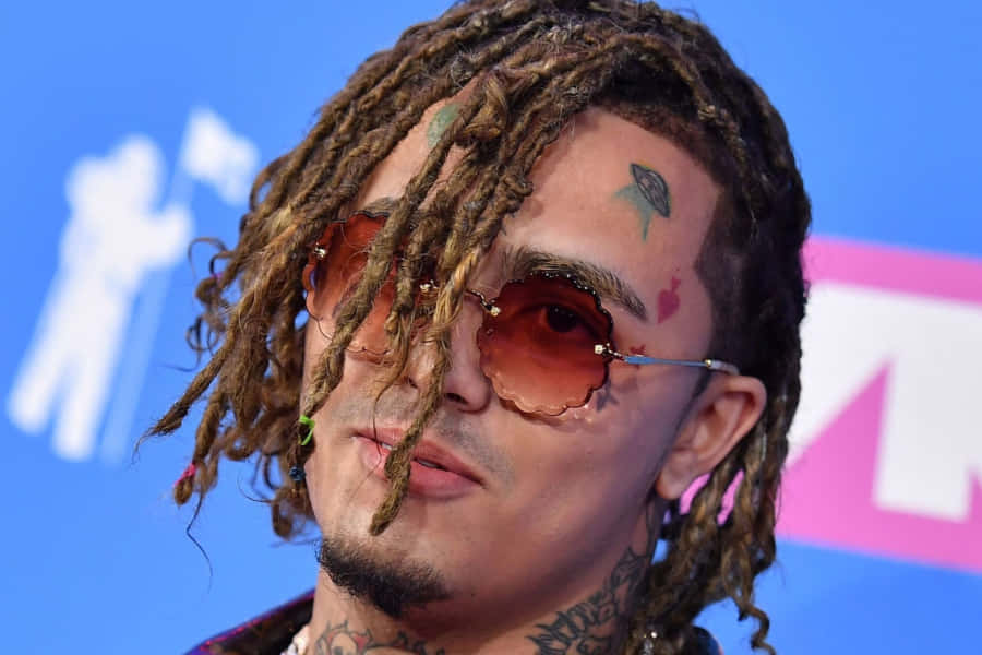 Lil Pump Rocking An Orange Hoodie Wallpaper