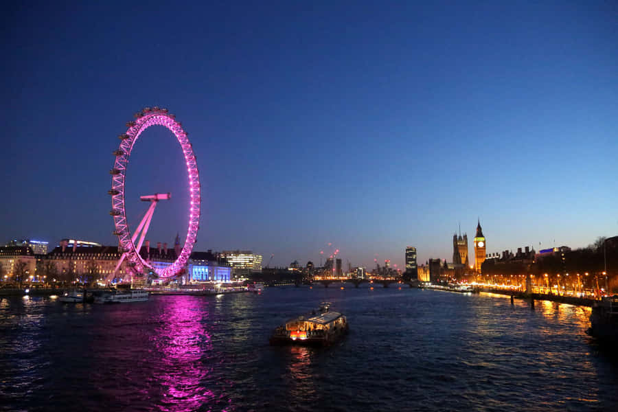London Eye Gleaming In Purple Lights Wallpaper