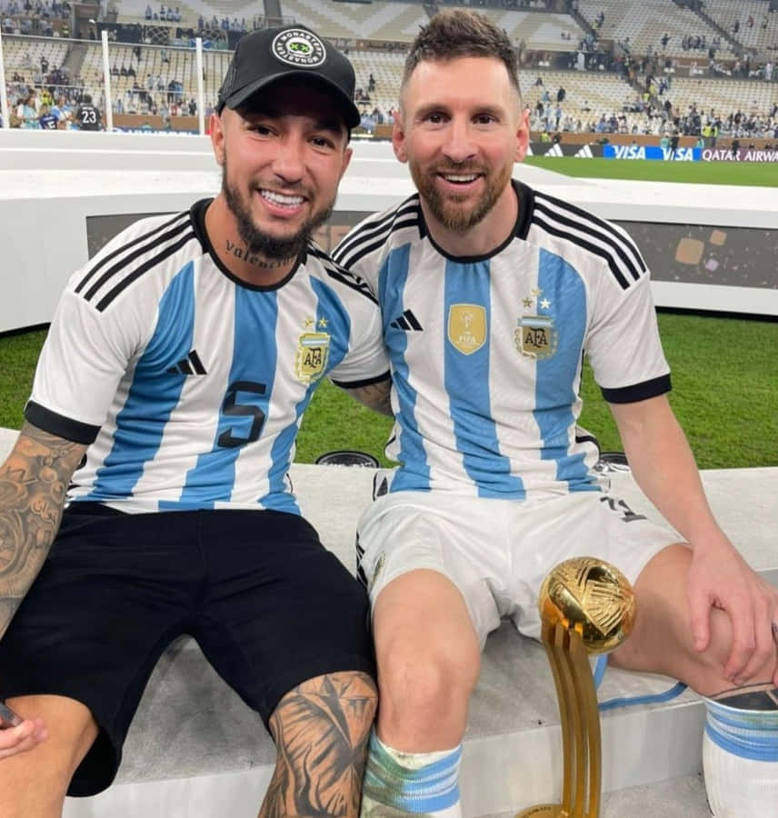 Luciano Acosta With Football Legend Messi Wallpaper