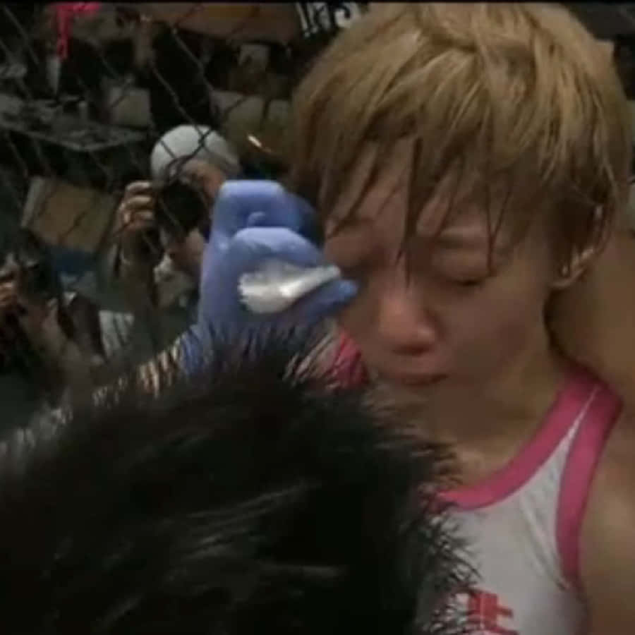 Megumi Fujii In Combat With Jessica Aguilar In 2012 Wallpaper