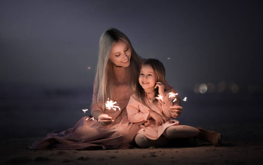 Mother And Daughter New Year Celebration Wallpaper