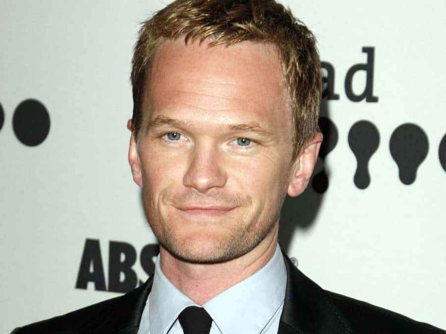 Neil Patrick Harris Looking Stylish In A Grey Suit Wallpaper