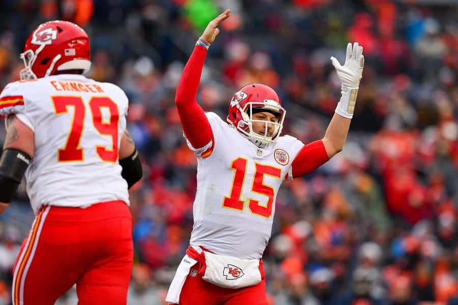 Nfl Mvp Pat Mahomes Embracing Technology Wallpaper