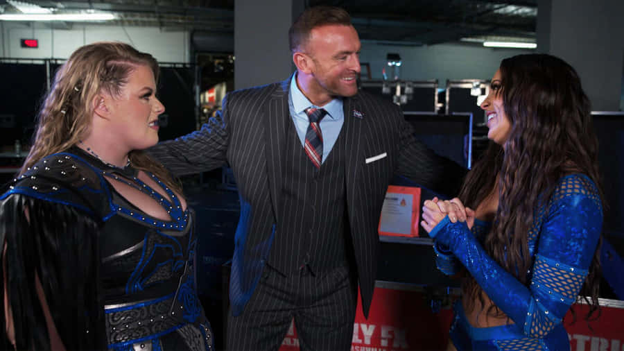 Nick Aldis Backstage With Wrestlers Wallpaper