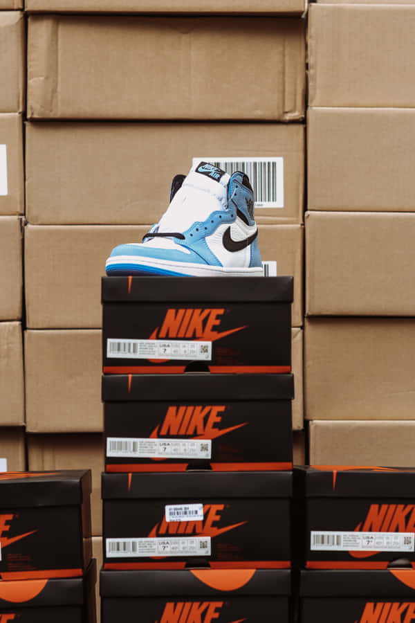 _photo A White Shoe Box With The Company's Logo, Perfect For Keeping Your Shoes Organized!_ Wallpaper