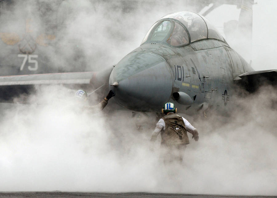 Pilot Ready To Board A Fighter Jet Wallpaper