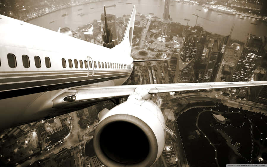 Plane Desktop In City Wallpaper