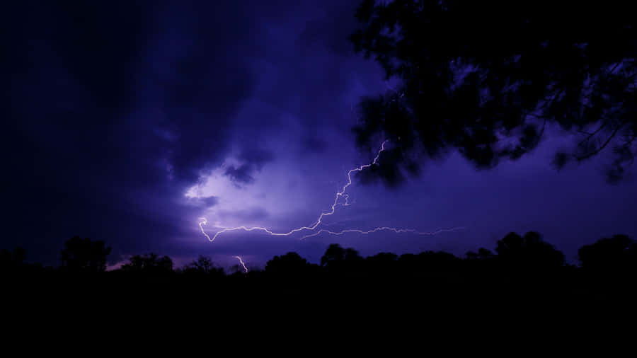 Purple Lightning With Dark Clouds Wallpaper