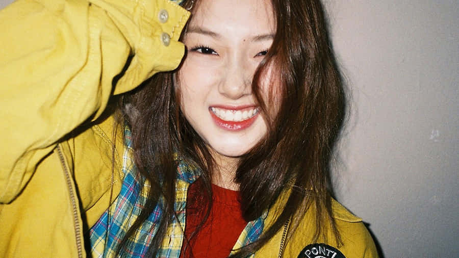 Radiant Smile Yellow Jacket Girl.jpg Wallpaper