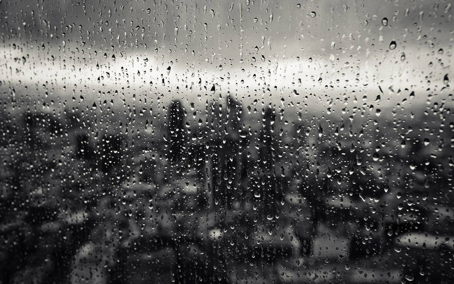 Raindrops On A Clear Glass Surface Wallpaper