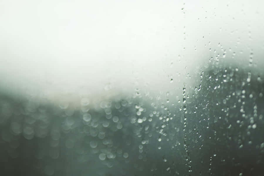 Raindropson Window Blurry Background.jpg Wallpaper