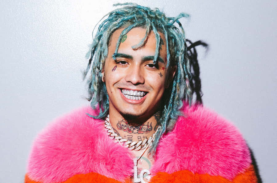 Rapper Lil Pump Illuminated Under Red Lights Wallpaper