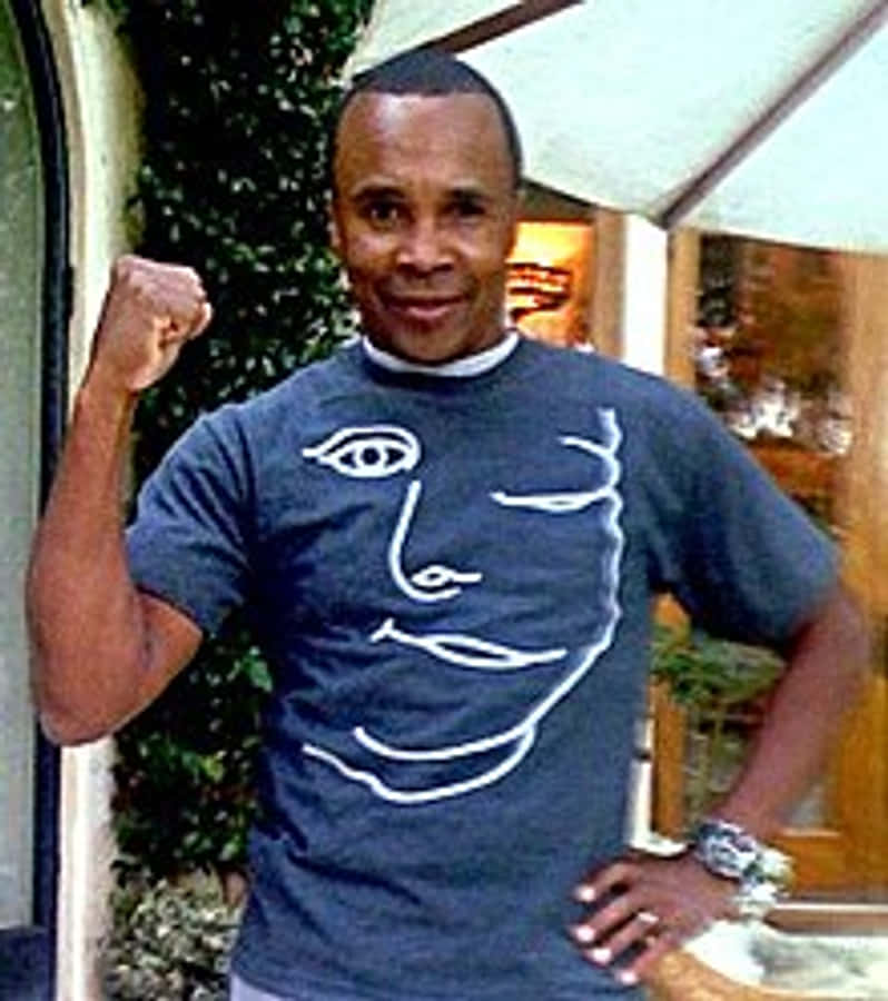 Ray Leonard Wearing A Blue Shirt Phone Wallpaper