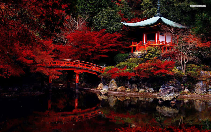 Red Pagoda In A Pond With Trees Wallpaper