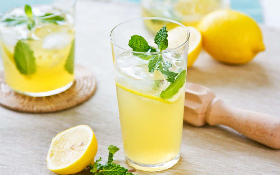 Refreshing Citrus Juice With Lemons And Mint Wallpaper