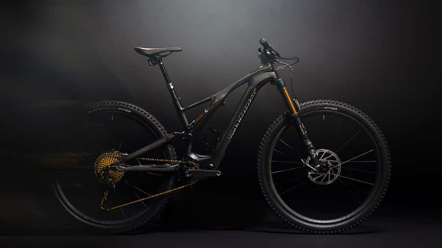 Ripping Roads On A Specialized Mountain Bike Wallpaper