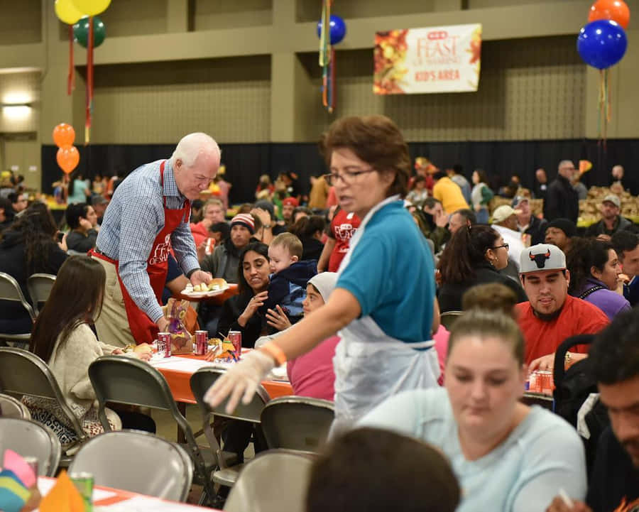 Senator John Cornyn Serving Food Wallpaper