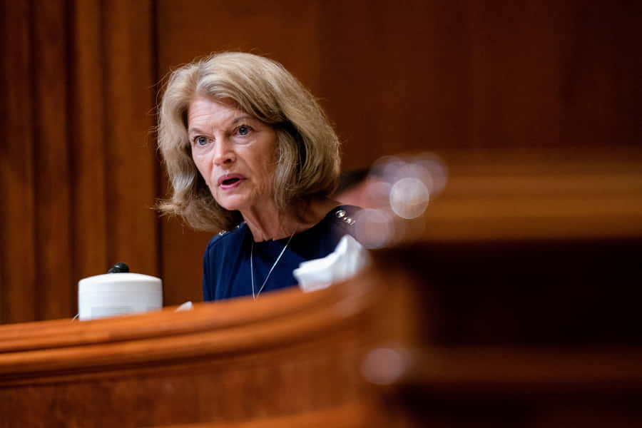 Senator Lisa Murkowski, Looking Serious During A Public Event Wallpaper