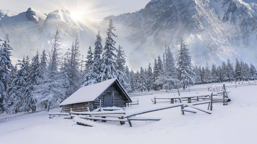 Serenity Amidst The Snow: An Enchanting Winter Retreat Wallpaper