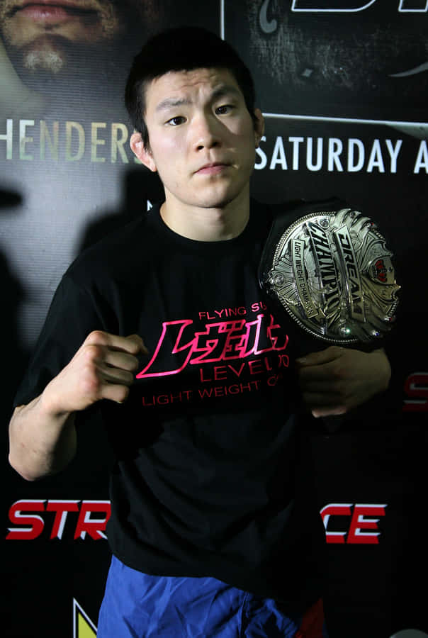 Shinya Aoki Asserting Dominance In The Strikeforce World Championship Tripleheader Wallpaper