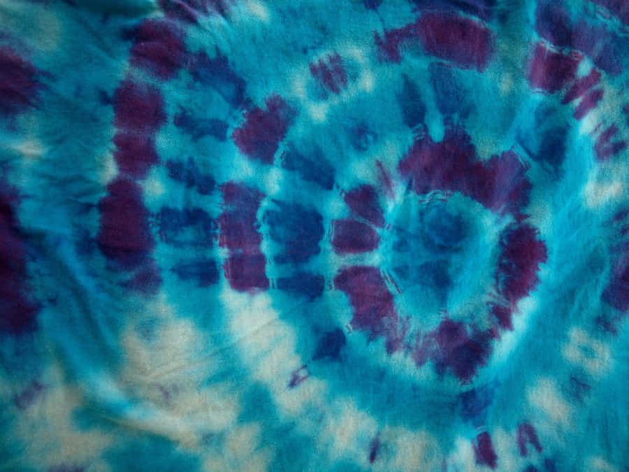 Show Off Your Creativity With A Unique Purple Tie Dye Pattern Wallpaper