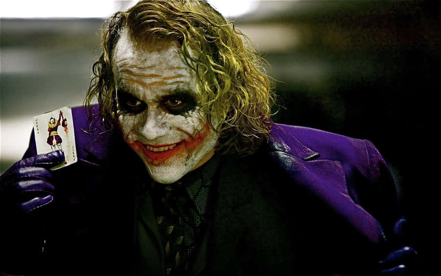 Smiling Joker Pfp With Playing Card Wallpaper