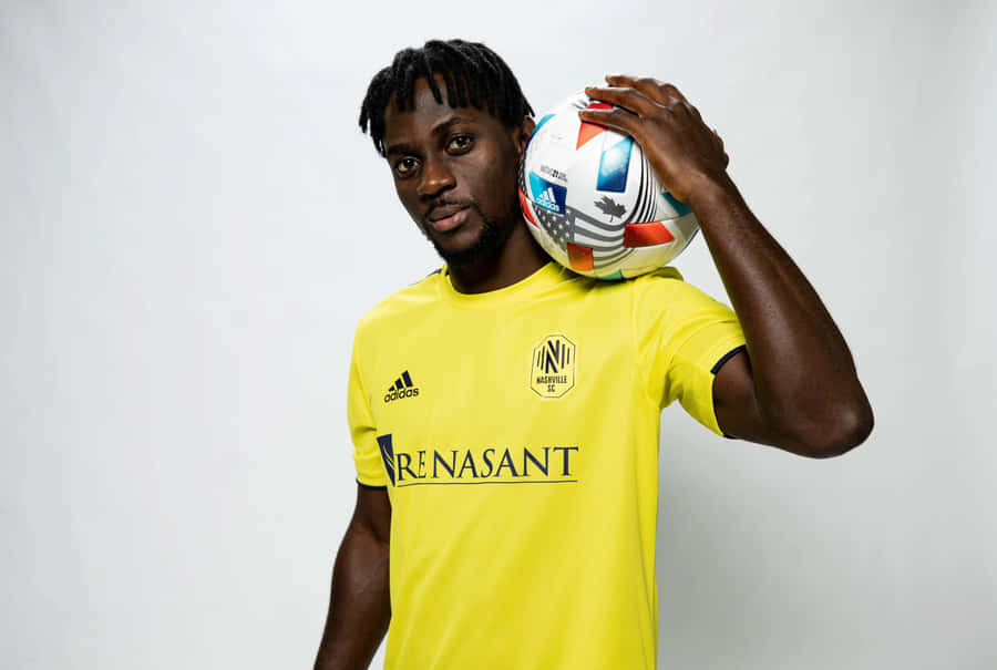 Soccer_ Player_ Holding_ Ball Wallpaper