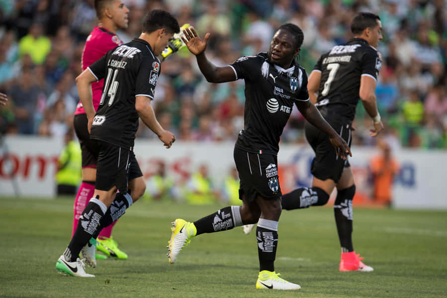 Soccer Players Celebrating On Field Wallpaper