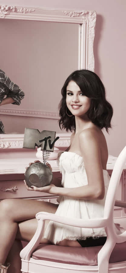 “stay Connected In Style With Selena Gomez’s Iphone” Wallpaper