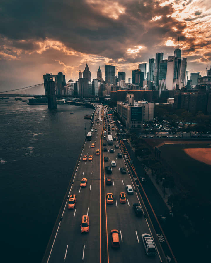 Sunset_ Cityscape_with_ Bridge_and_ Highway.jpg Wallpaper