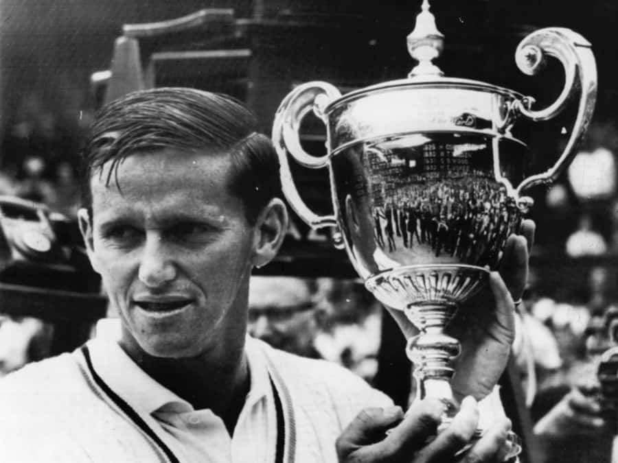 Tennis Champion Roy Emerson With Trophy Wallpaper
