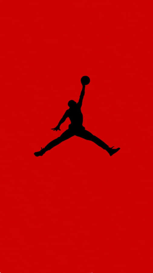 The Iconic Jordan Logo Stands Out Against A Modern Smartphone. Wallpaper