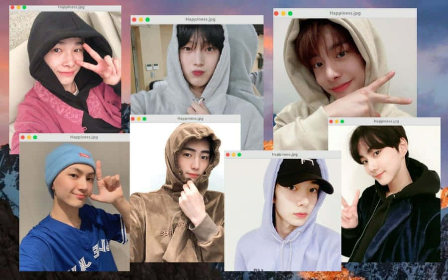 The Members Of South Korean Boy Band Enhypen Looking At Their New Enhypen Laptop Wallpaper