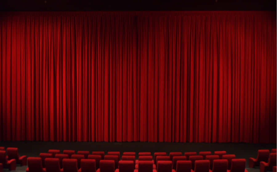 Theater With Long Red Curtains Wallpaper