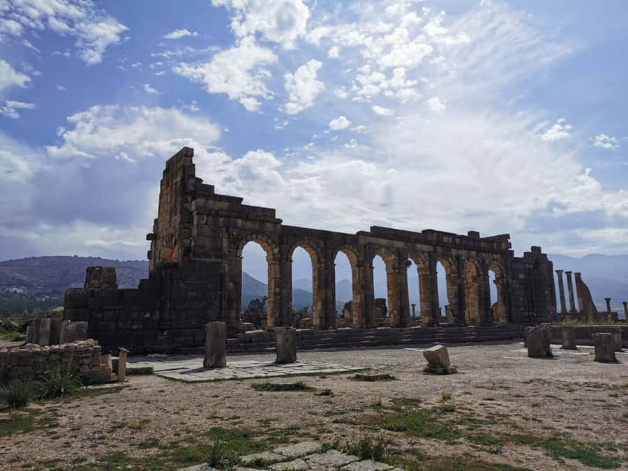 Timeless Remains Of Volubilis Arch Ruins Wallpaper