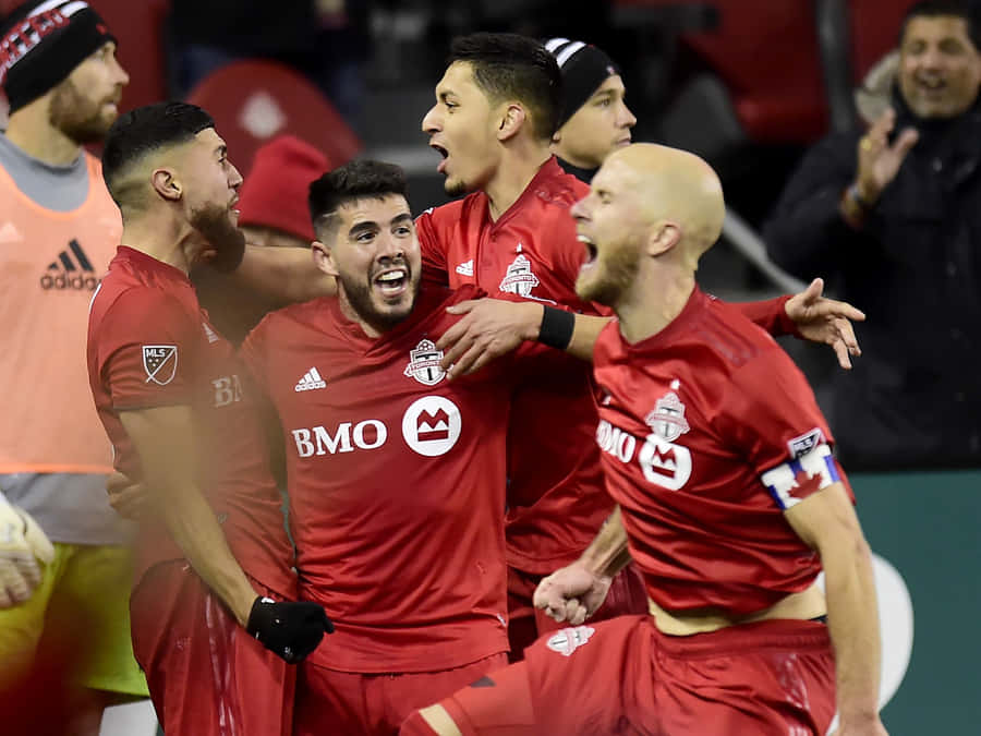 Toronto Fc Alejandro Pozuelo With Teammates Wallpaper