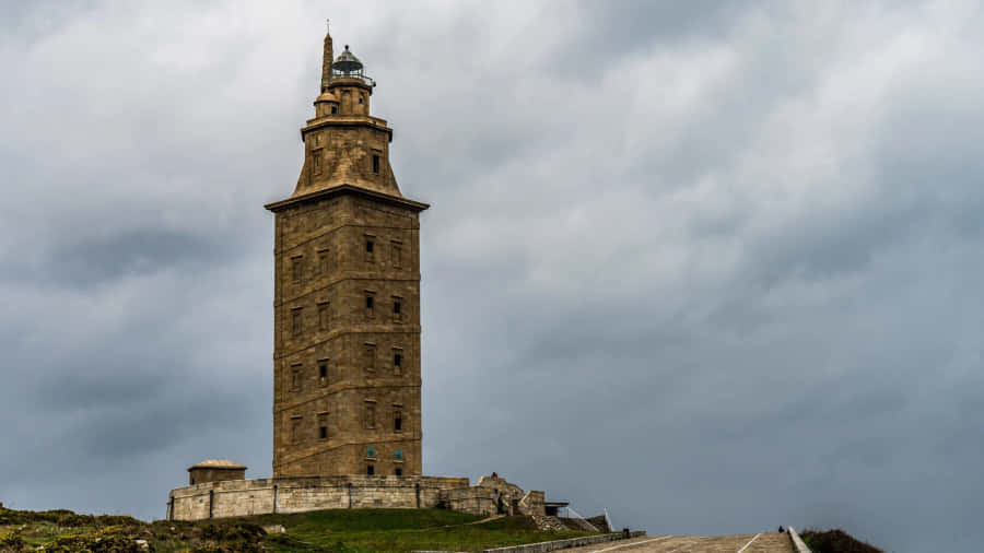 Tower Of Hercules Beneath Cloudy Sky Desktop Wallpaper