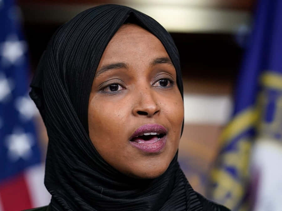 U.s. Representative Ilhan Omar Speaking Passionately Wallpaper
