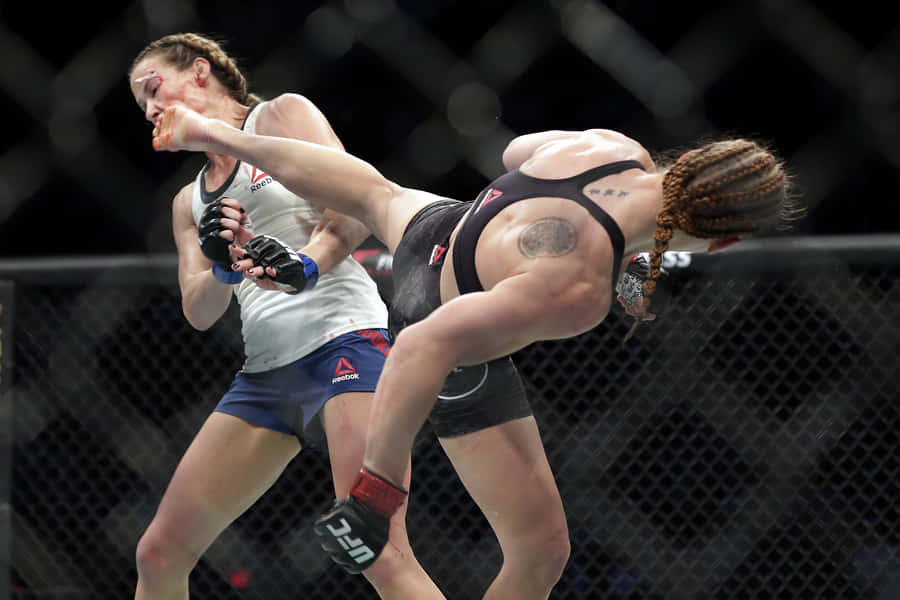 Ufc Fighter Katlyn Chookagian Delivering A Powerful Kick Wallpaper