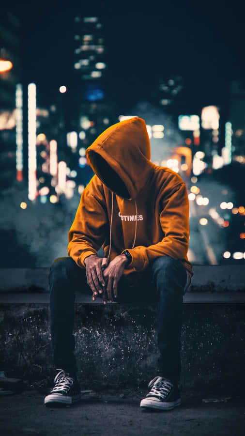 Vibrant Yet Melancholic - Cool Sad Boy In Yellow Hoodie Wallpaper