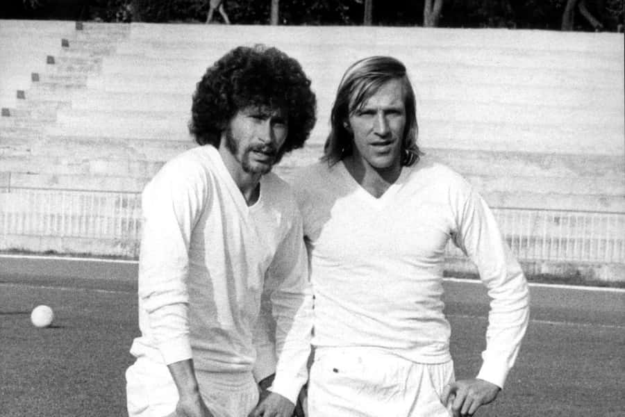 Vintage Football Players Blackand White Photo Wallpaper