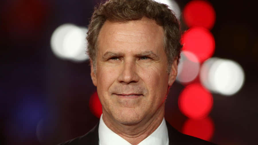 Will Ferrell Striking A Pose In A Classy Suit Wallpaper